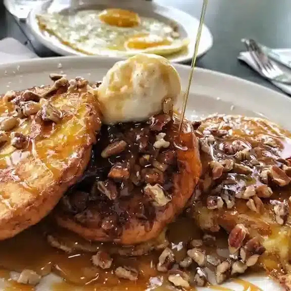 Caramel pecan pancakes with butter and syrup