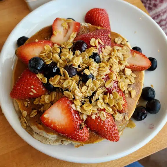 Granola bowl with strawberries blueberries and yogurt